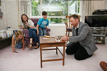 magician impressing family at a home in hertfordshire